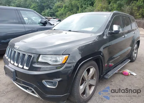 2014 Jeep Grand Cherokee Overland z USA, uszkodzony, nr VIN 1C4RJFCG4EC415991